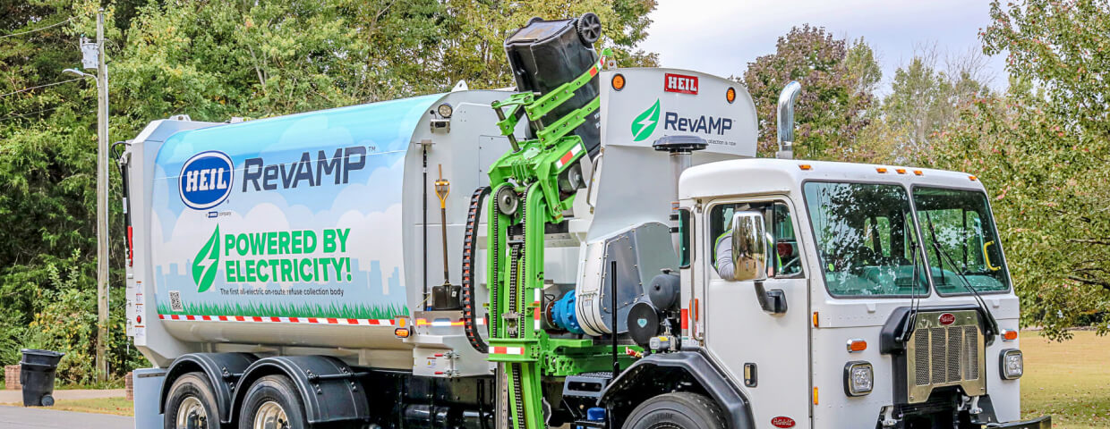 Garbage trucking picking up receptacle