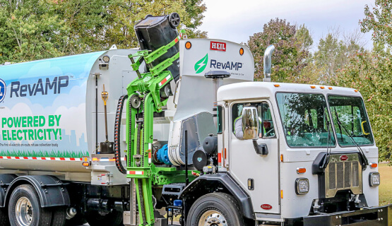 Garbage truck picking up receptacle