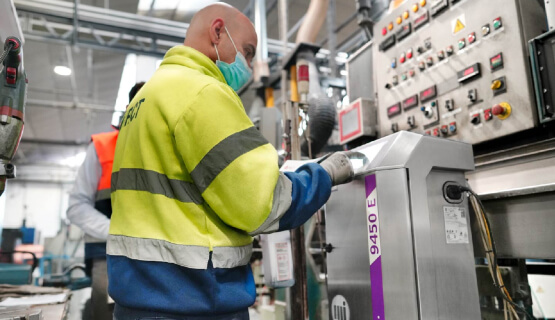 Man working at large scale printing machine