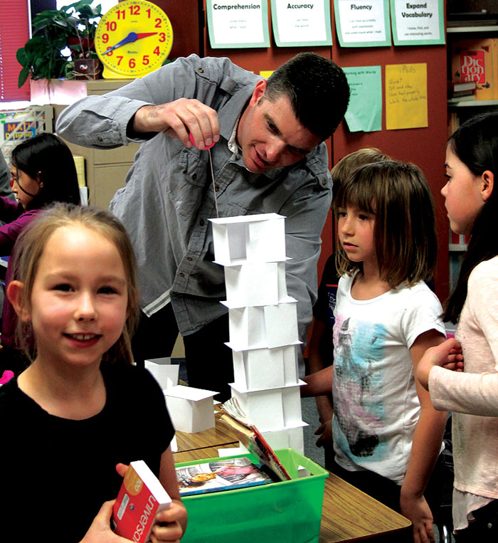 landon-garner-measures-one-of-the-towers-built-by-students-at-Creekview landon-garner-measures-one-of-the-towers-built-by-students-at-Creekview