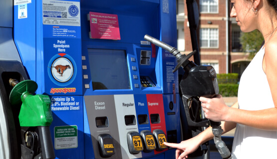 Fueling Solutions Woman using fuel dispenser